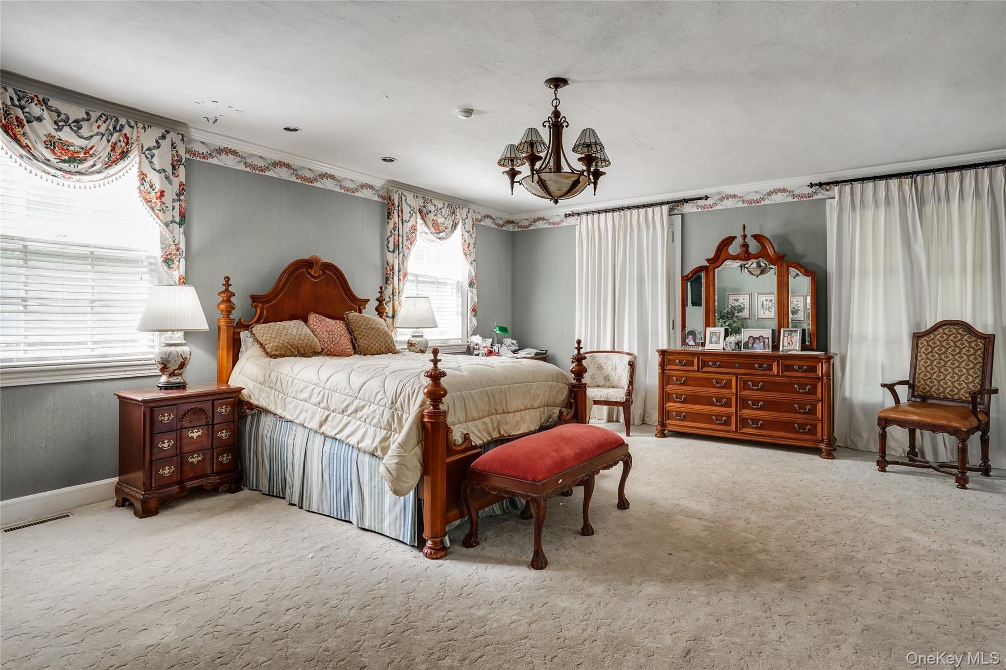 274 River Road St. James, NY 11780 - Photo 15 of 30 a bedroom with a bed dresser and a window