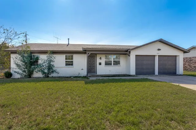 a view of a house with a garden