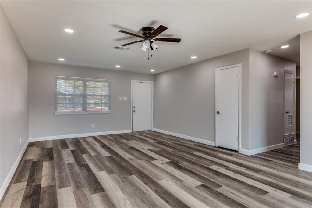 809 Michelle Drive Everman, TX 76140 - Photo 3 of 11 a view of a room with a ceiling fan and hardwood floor