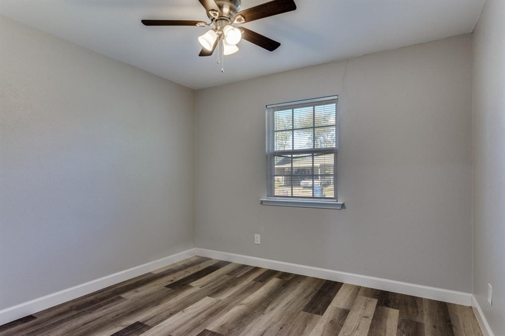 809 Michelle Drive Everman, TX 76140 - Photo 9 of 11 a view of an empty room with a window