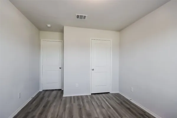 a bathroom with a granite countertop sink a toilet and bathtub