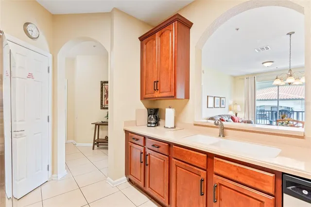 a spacious bathroom with a double vanity sink a toilet and a mirror