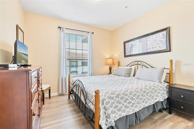 a bedroom with a bed and dresser