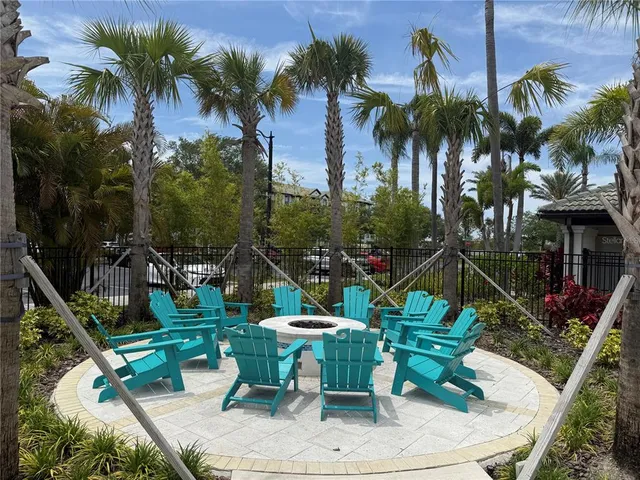 a view of a swimming pool with a table and chairs