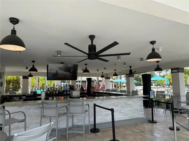 a view of a swimming pool with an outdoor space and seating area