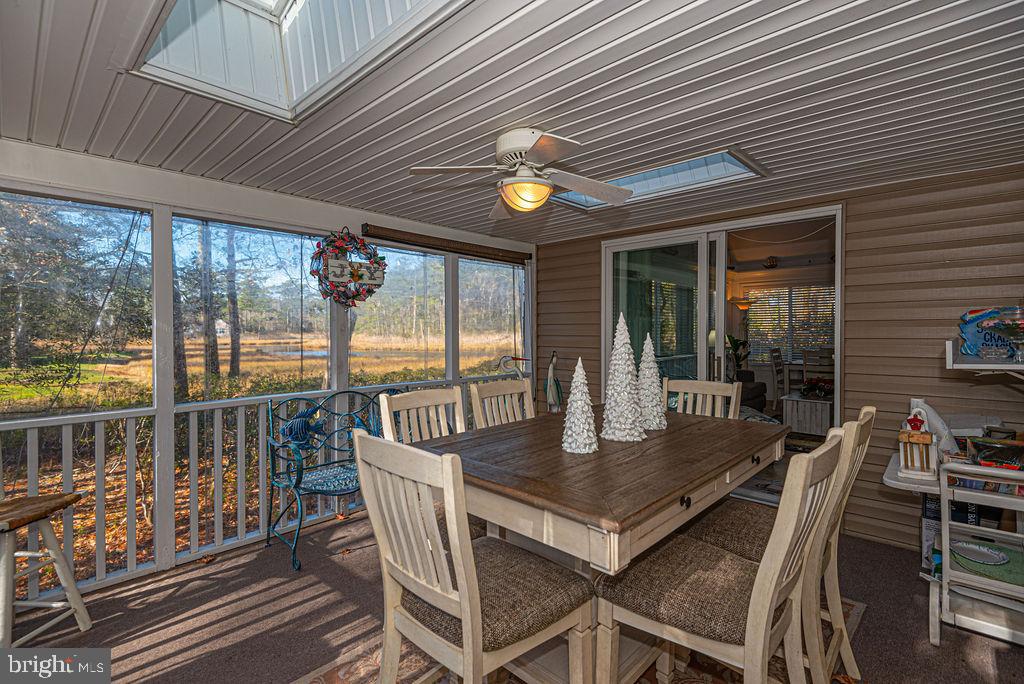 19 Mist Flower Road Ocean Pines, MD 21811 - Photo 14 of 36 a view of a dining room with furniture wooden floor and chandelier