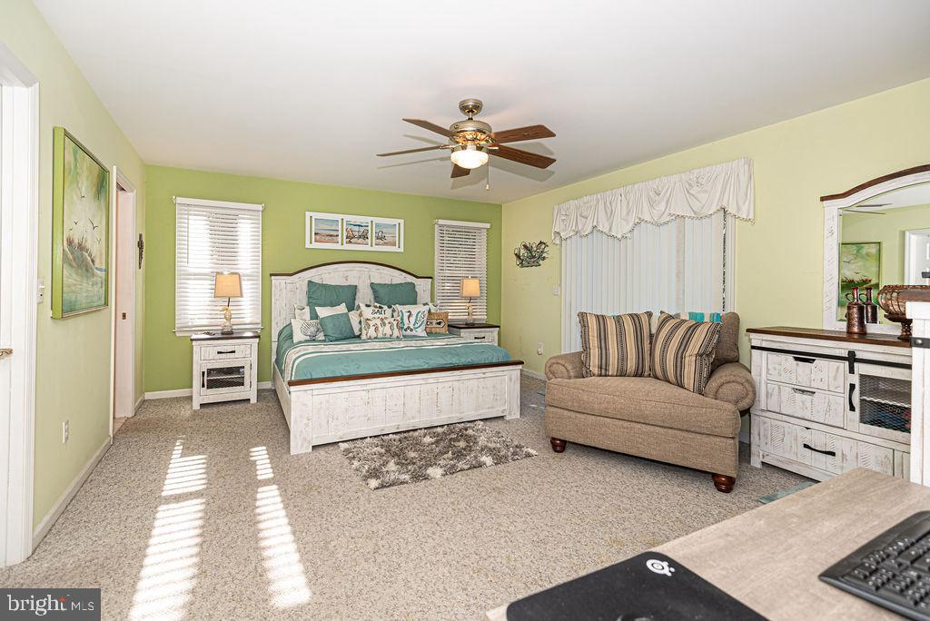19 Mist Flower Road Ocean Pines, MD 21811 - Photo 17 of 36 a living room with furniture and a chandelier