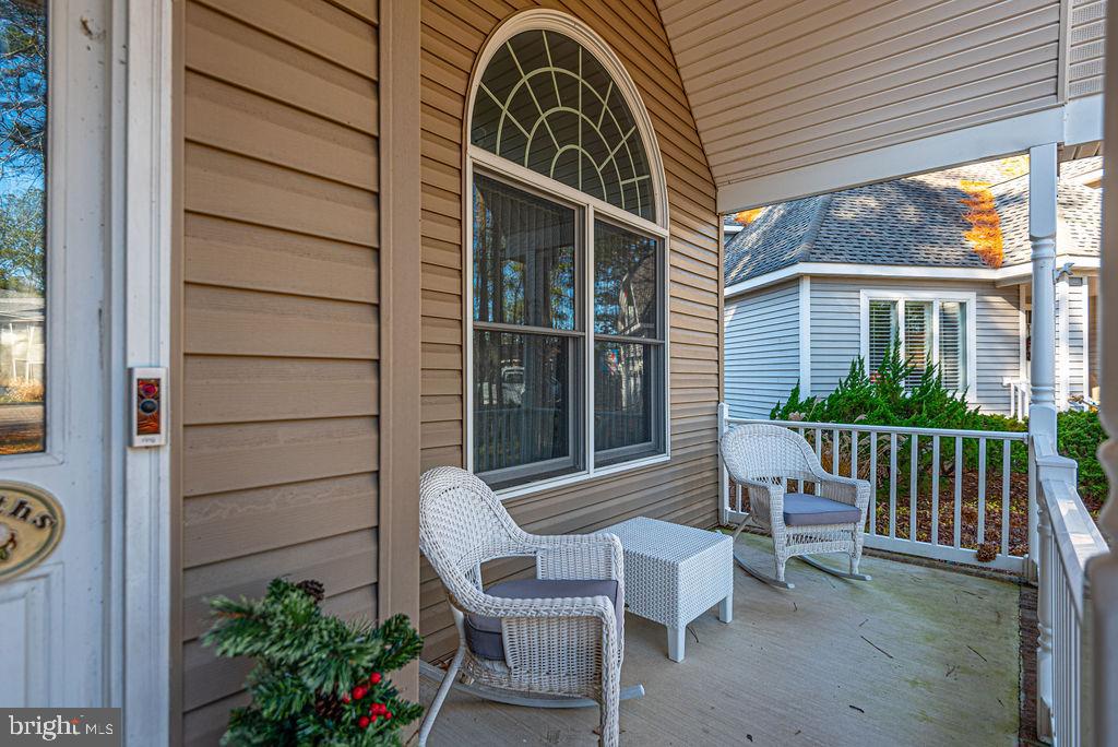 19 Mist Flower Road Ocean Pines, MD 21811 - Photo 3 of 36 a view of a chair and table in the balcony