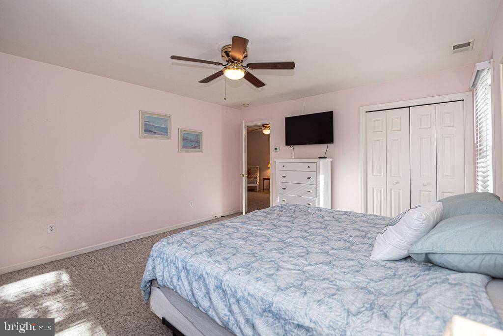 19 Mist Flower Road Ocean Pines, MD 21811 - Photo 23 of 36 a bedroom with a bed and a flat screen tv