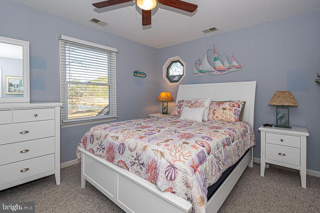 19 Mist Flower Road Ocean Pines, MD 21811 - Photo 28 of 36 a bedroom with a bed and window