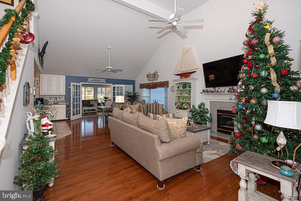 19 Mist Flower Road Ocean Pines, MD 21811 - Photo 4 of 36 a living room with furniture a flat screen tv and a fireplace