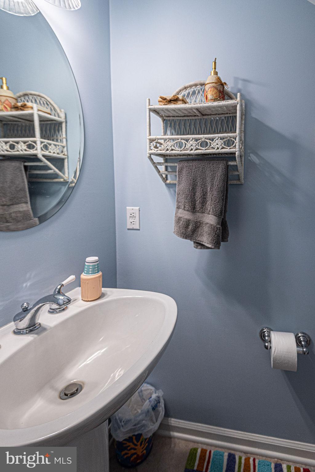 19 Mist Flower Road Ocean Pines, MD 21811 - Photo 8 of 36 a bathroom with a sink and a mirror