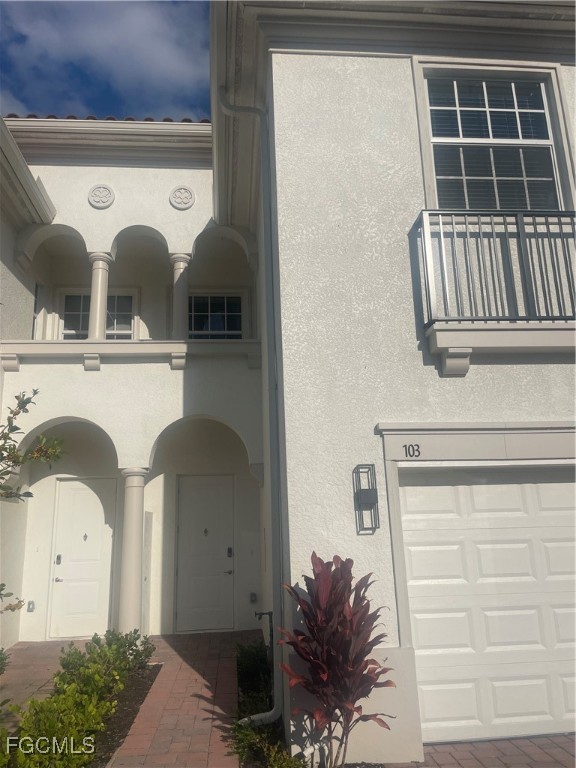 7044 Ambrosia Lane, Unit 103 Naples, FL 34119 - Photo 2 of 20 a bathroom with a sink and a mirror
