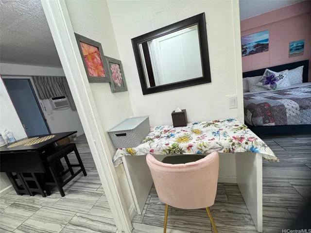 a dining room with furniture and wooden floor