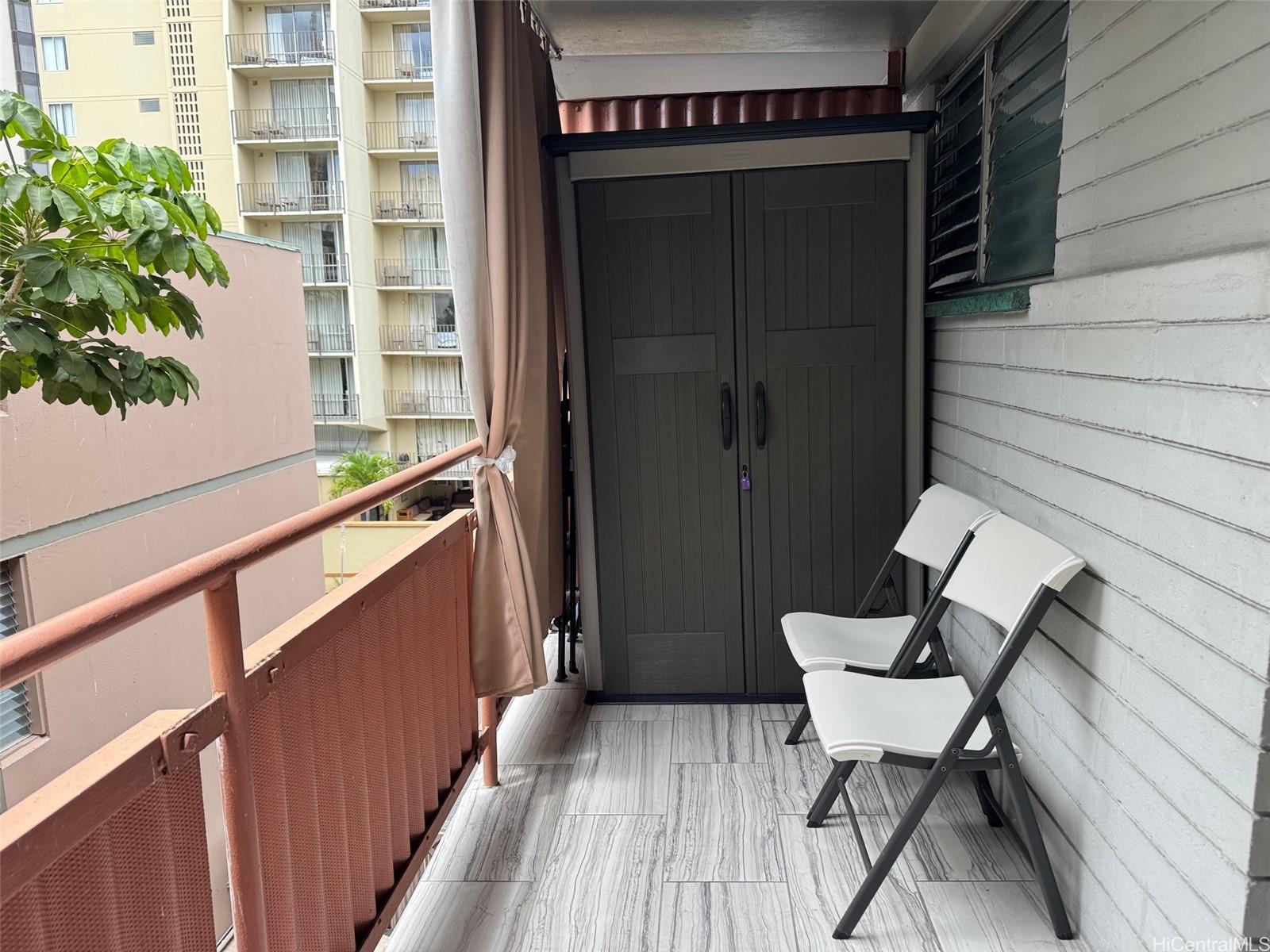 417 Nohonani Street, Unit 410 Honolulu, HI 96815 - Photo 19 of 20 a view of a house with backyard and sitting area