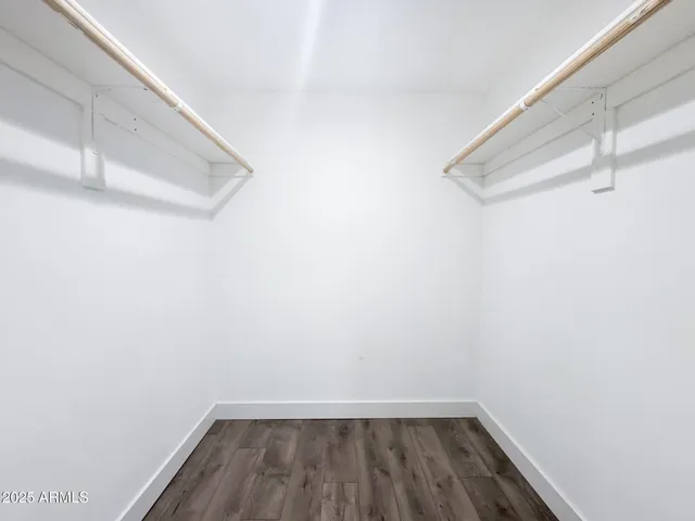 a bathroom with a sink a toilet a mirror and shower