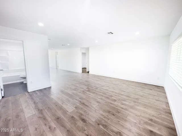 a front view of house with yard and trees