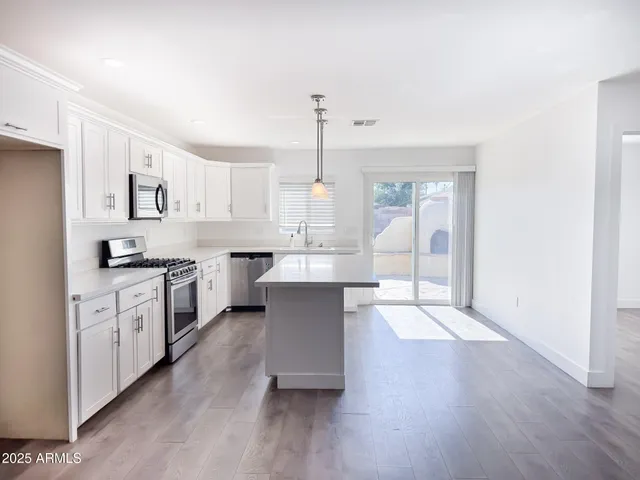 a view of kitchen with wooden floor