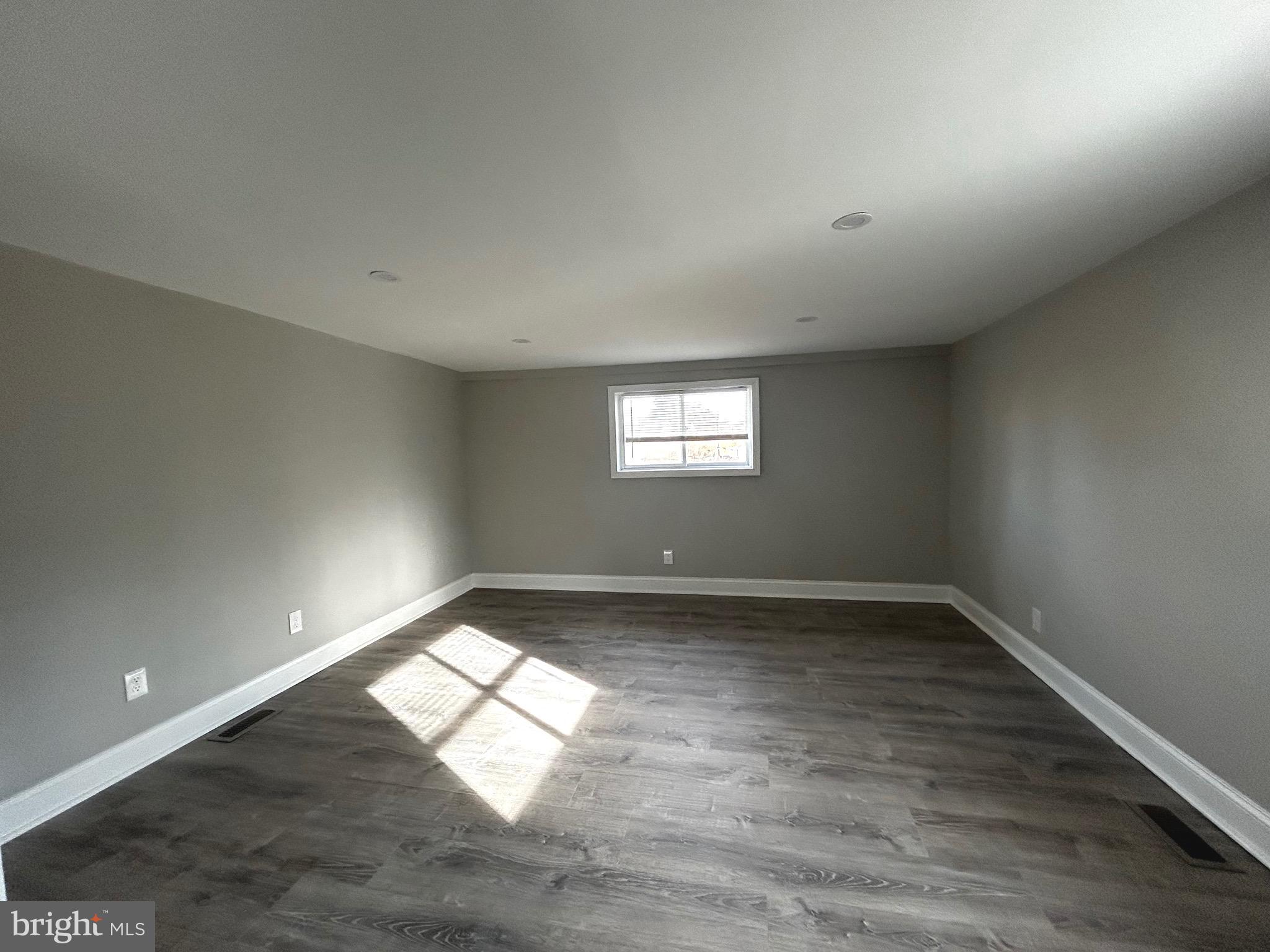 448 Plum Alley Spring City, PA 19475 - Photo 11 of 15 an empty room with wooden floor and windows