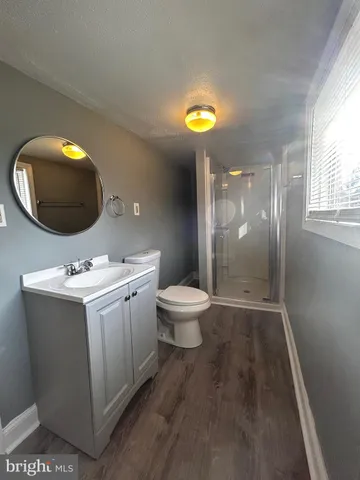 a view of bathroom with a toilet and a sink