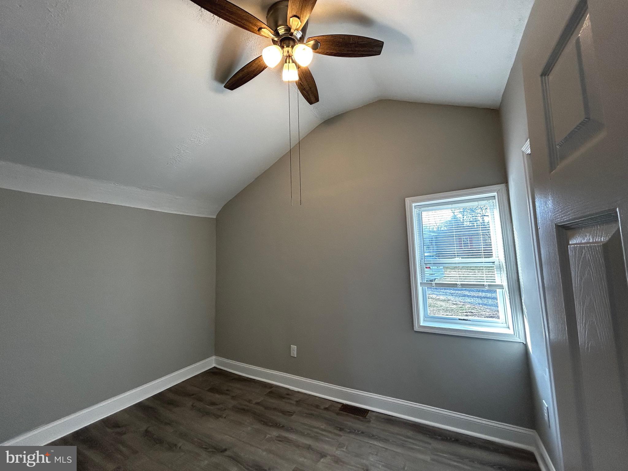 448 Plum Alley Spring City, PA 19475 - Photo 7 of 15 an empty room with wooden floor fan and windows