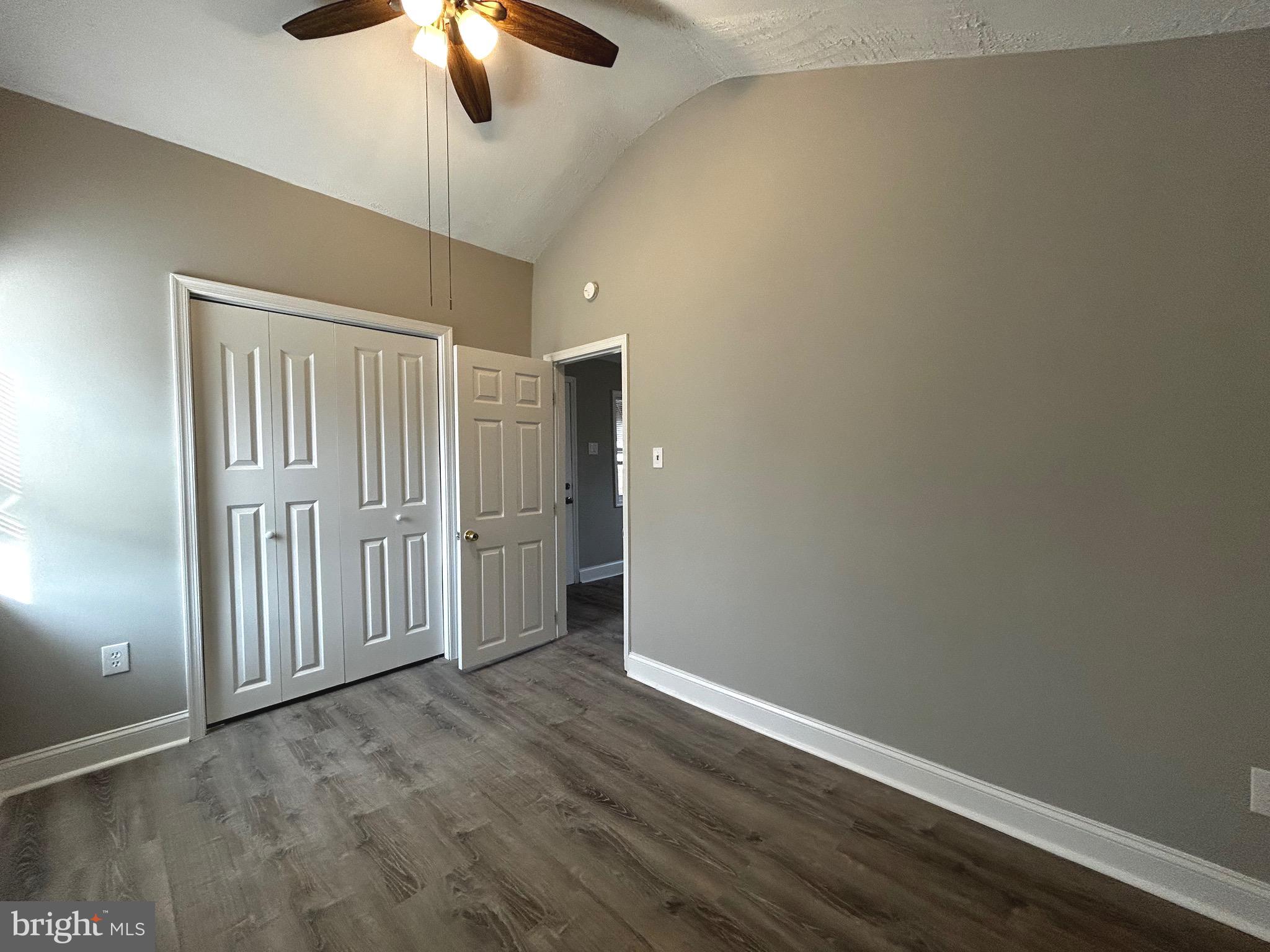 448 Plum Alley Spring City, PA 19475 - Photo 8 of 15 an empty room with wooden floor fan and window