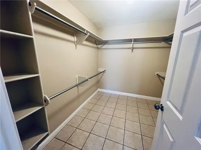 a view of an empty walk in closet