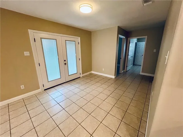 a view of an empty room and window