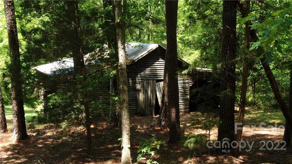 10749 Harrisburg Road Indian Land, SC 29707 - Photo 20 of 38 a backyard of a house with lots of green space