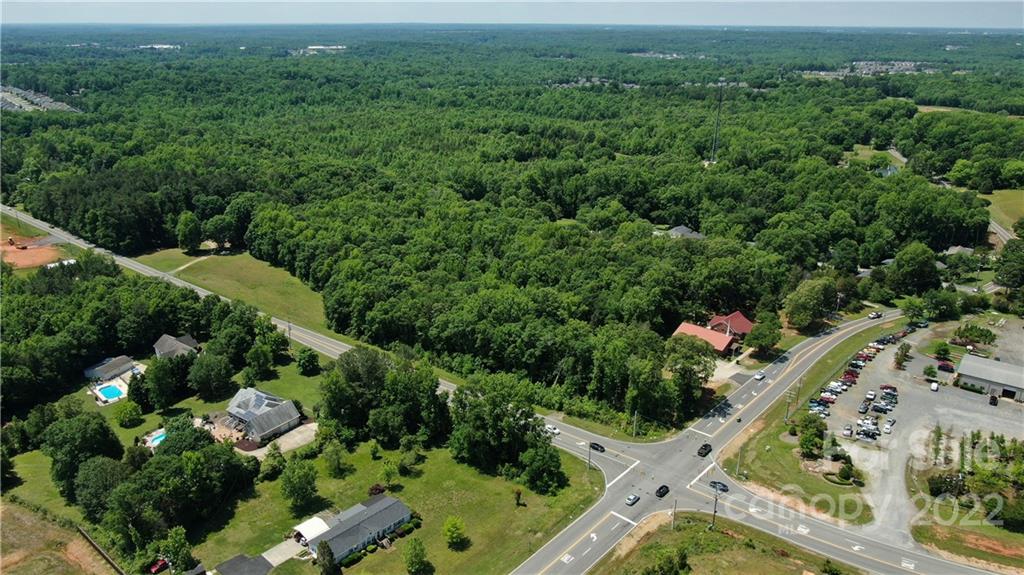 10749 Harrisburg Road Indian Land, SC 29707 - Photo 25 of 38 view of a city with lush green forest