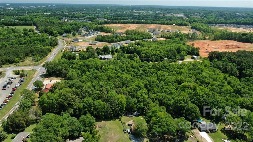 10749 Harrisburg Road Indian Land, SC 29707 - Photo 31 of 38 an aerial view of residential house with outdoor space and trees all around