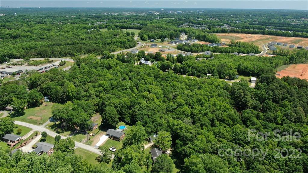 10749 Harrisburg Road Indian Land, SC 29707 - Photo 34 of 38 an aerial view of residential house with outdoor space and trees all around