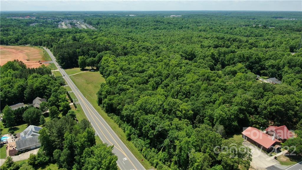 10749 Harrisburg Road Indian Land, SC 29707 - Photo 35 of 38 an aerial view of residential house with outdoor space and trees all around