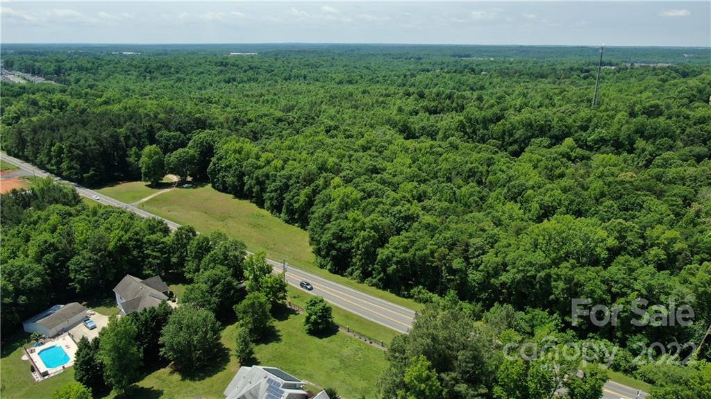 10749 Harrisburg Road Indian Land, SC 29707 - Photo 36 of 38 a view of a green yard with large trees