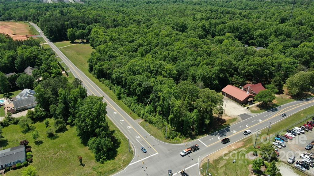 10749 Harrisburg Road Indian Land, SC 29707 - Photo 5 of 38 an aerial view of a house with a yard and outdoor seating