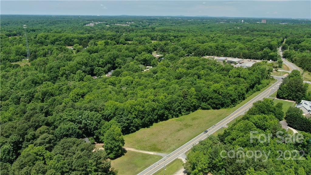 10749 Harrisburg Road Indian Land, SC 29707 - Photo 7 of 38 an aerial view of residential houses with outdoor space and trees