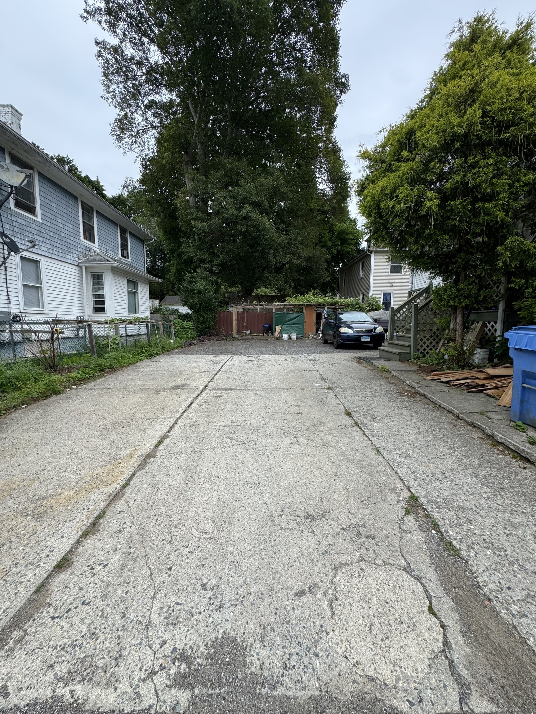 478 East Main Street Norwich, CT 06360 - Photo 18 of 19 a backyard of a house with parked cars