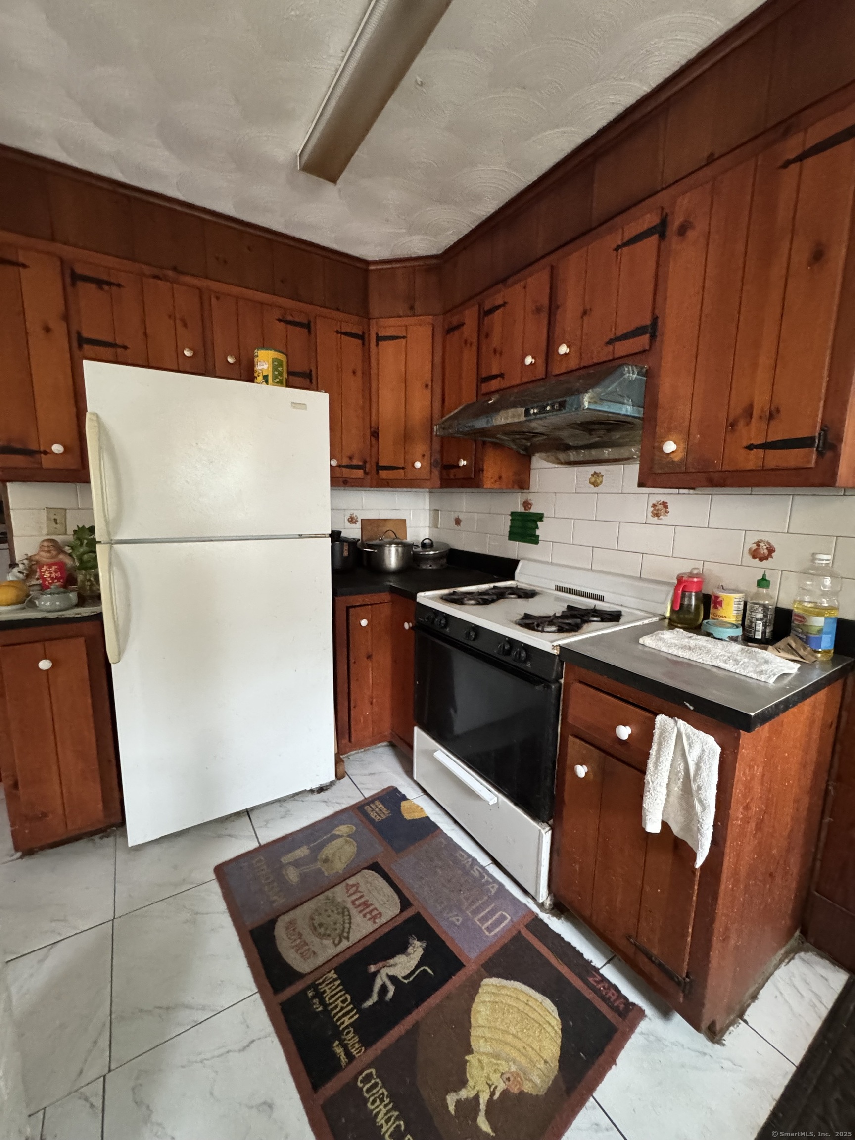 478 East Main Street Norwich, CT 06360 - Photo 4 of 19 a kitchen with a sink appliances and cabinets