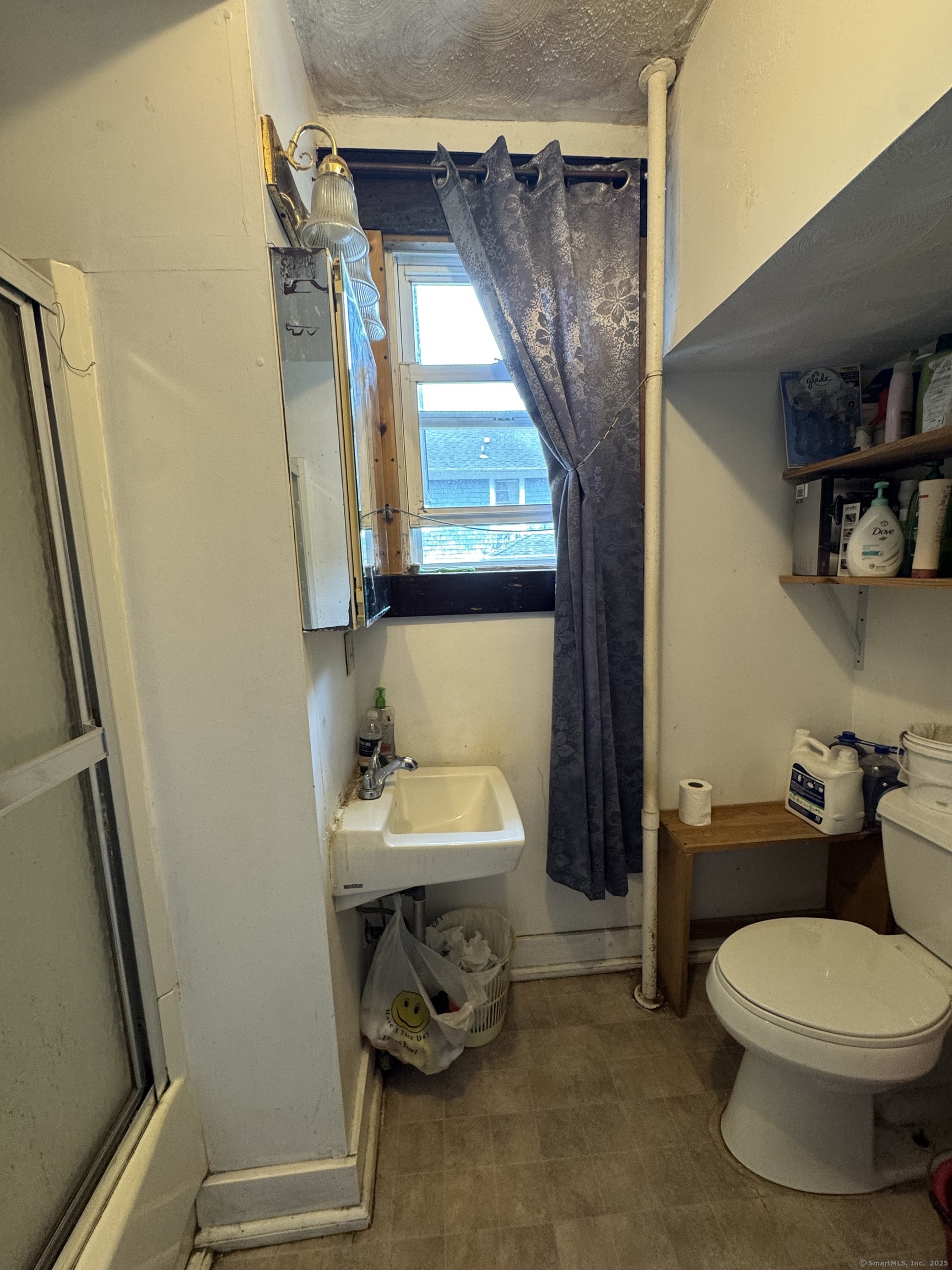 478 East Main Street Norwich, CT 06360 - Photo 7 of 19 a bathroom with a toilet a sink and a mirror