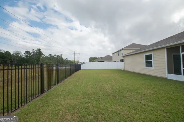 a view of a backyard with a garden