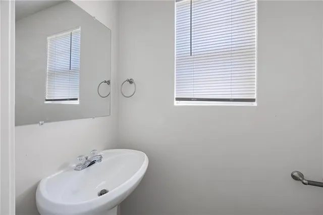 a bathroom with a sink and a window