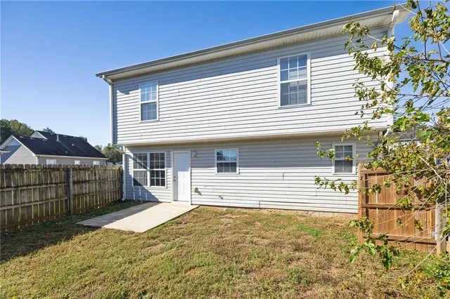 a front view of a house with a garage