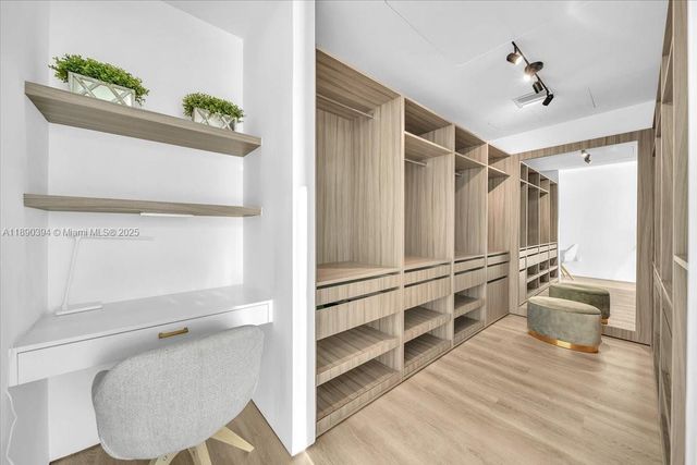 a bathroom with a shower a toilet and a window