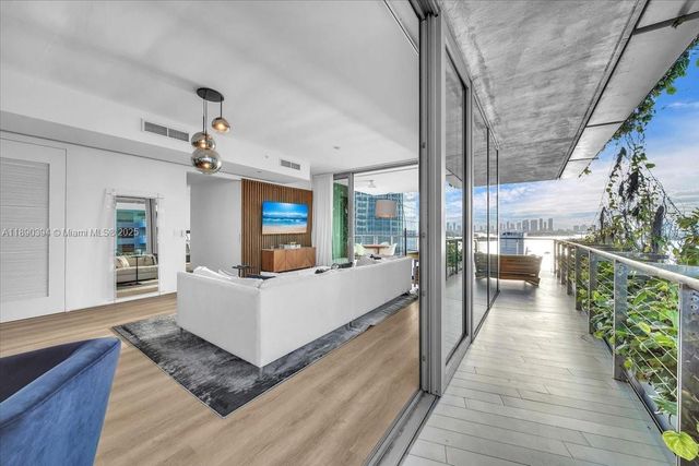 a view of a living room and a wooden floor