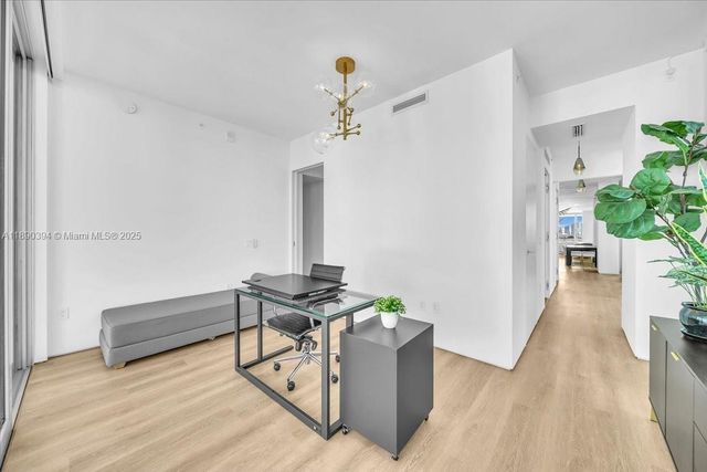 a view of hallway with furniture