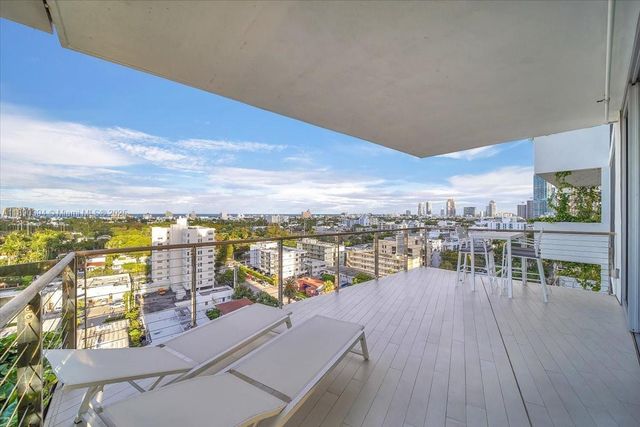a view of a balcony with ocean view