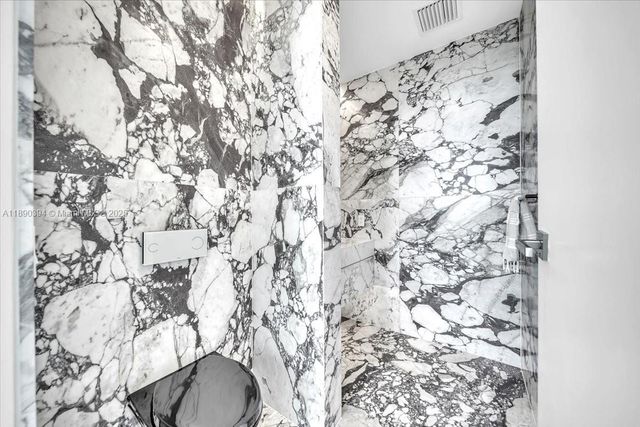 a bathroom with a bathtub and shower curtain