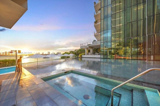 a view of swimming pool with a lake