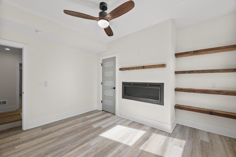 343 46th Street Pittsburgh, PA 15201 - Photo 21 of 40 a view of a livingroom with an empty space and a ceiling fan