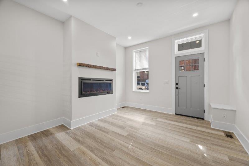 343 46th Street Pittsburgh, PA 15201 - Photo 4 of 40 a view of an empty room with wooden floor and a window